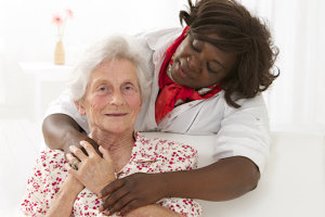 Happy senior patient with friendly female nurse